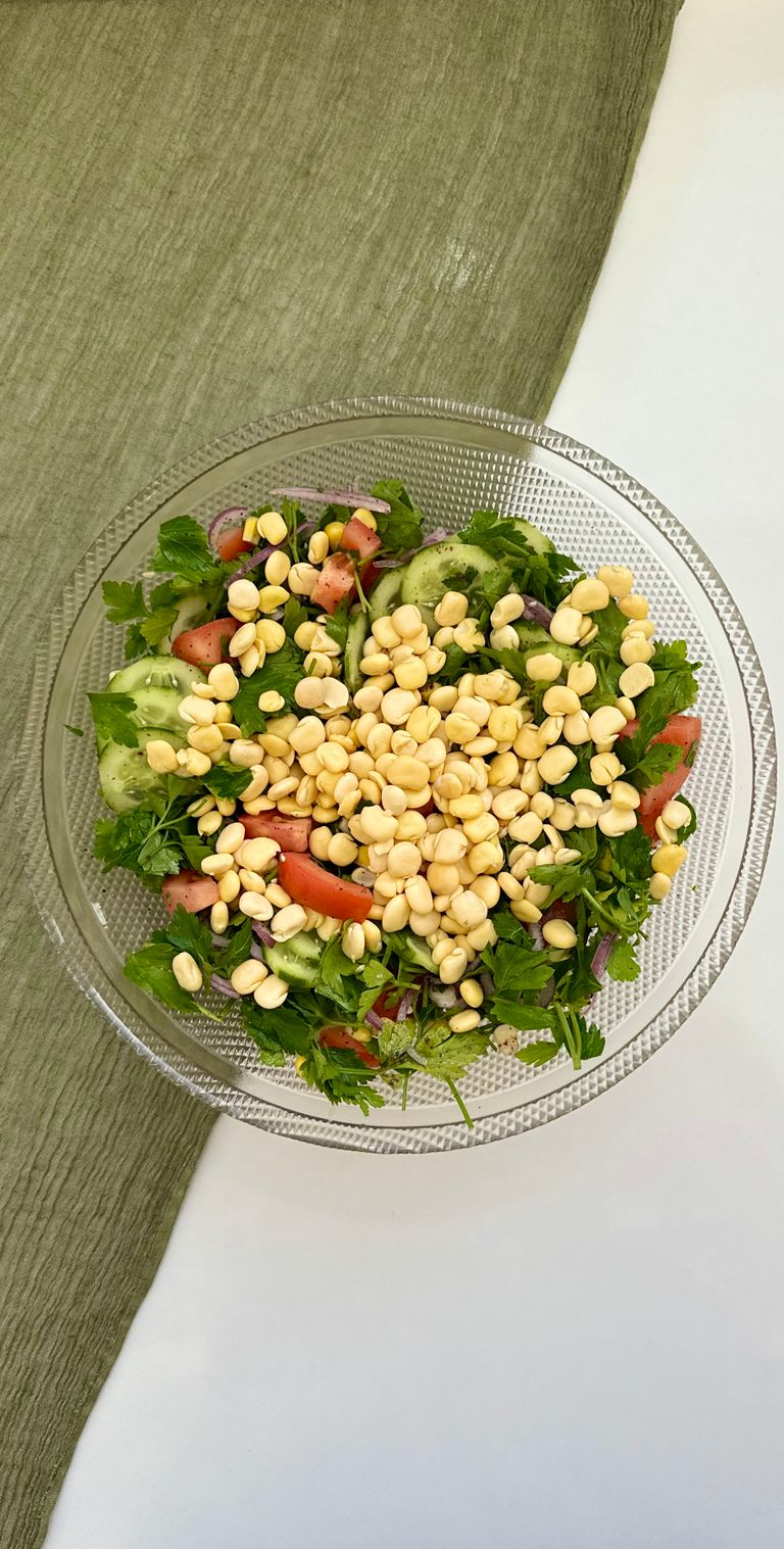 Vegetable and bean salad in a glass bowl